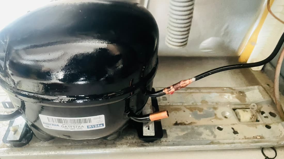 Compressor wiring being repaired