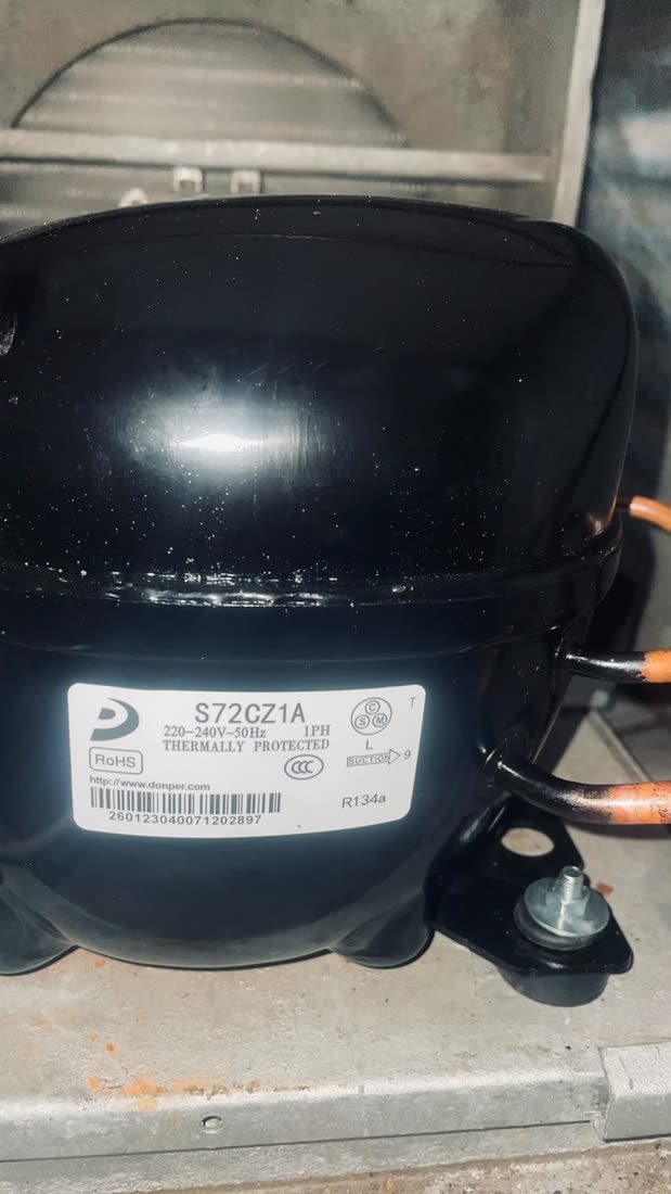Refrigeration compressor nameplate close-up